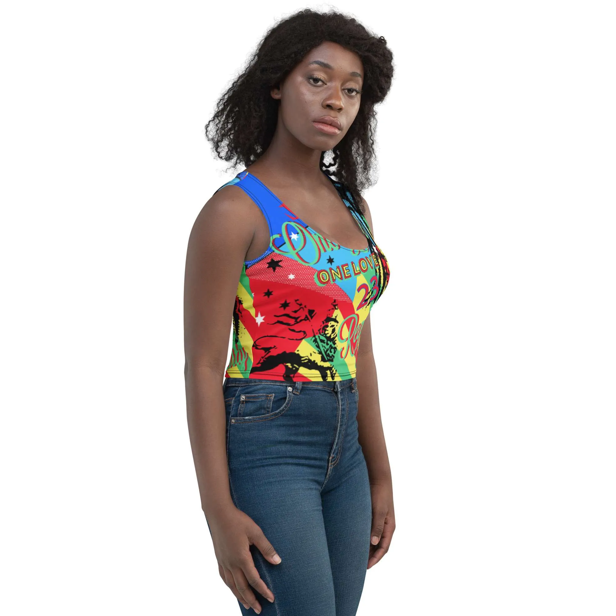 One Love Reggae Rasta Party Crop Top female model right side front view. Four way stretch comfortable micro fibre fabric in vivid colors and funky graphic design.