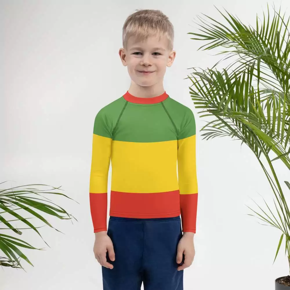 Rasta Kids Rash Guard child view in red gold and green. Protect the kids from sun and let them surf all day with this fun rashie. Available at Rastaseed online shop.