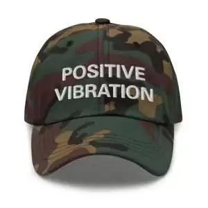 Positive Vibration Rasta Cap front view authentic Jamaican Rastafarian style. Available in khaki camouflage and black with embroidered lettering.