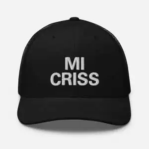 Mi Criss Jamaican Patois Trucker Cap front view. Stylish cap in black with mesh back and curved visor. Great merchandise at Rastaseed Rasta Shop.