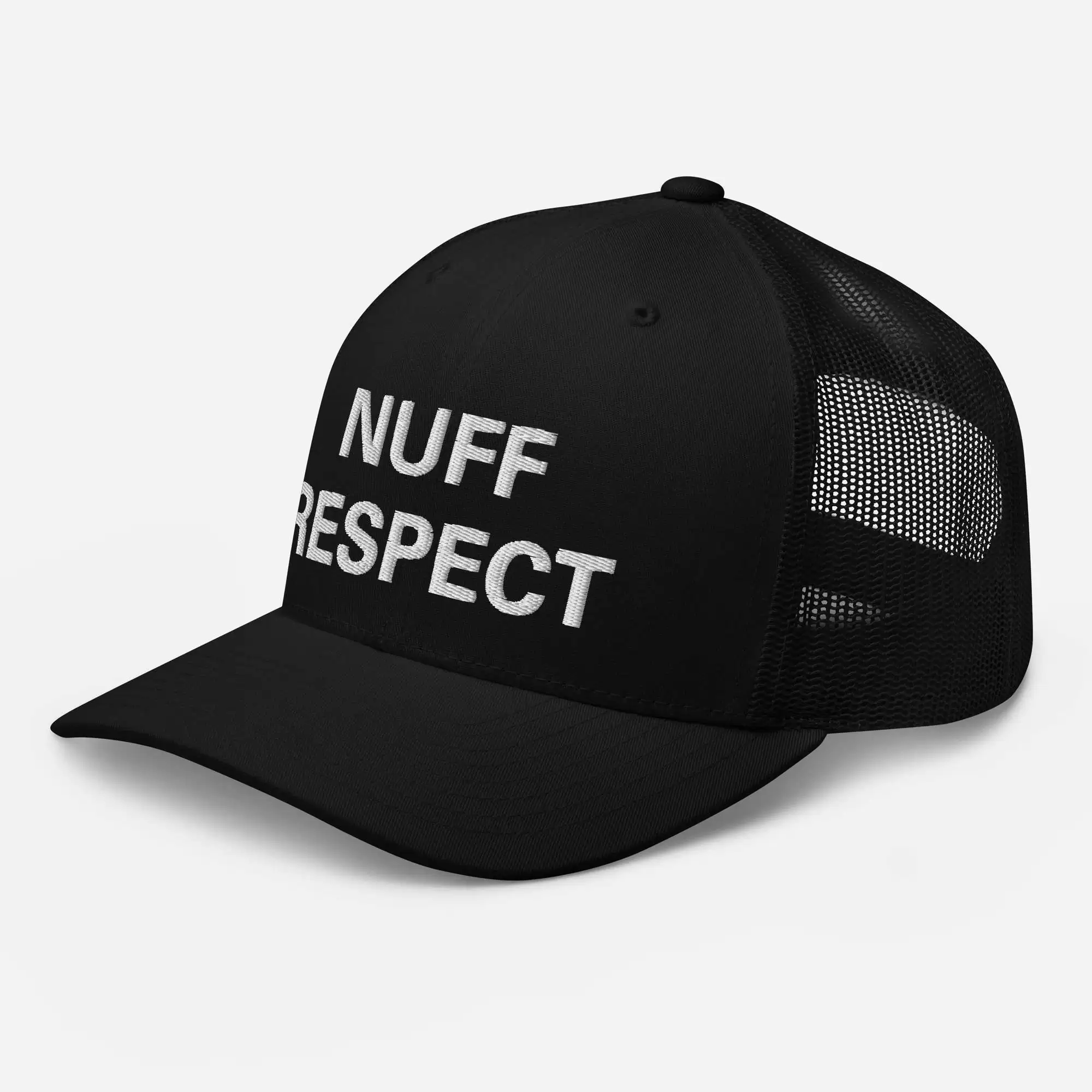 Nuff Respect Jamaican Trucker Cap side view. Original embroidered Patois phrase on black trucker hat with mesh back and curved visor.