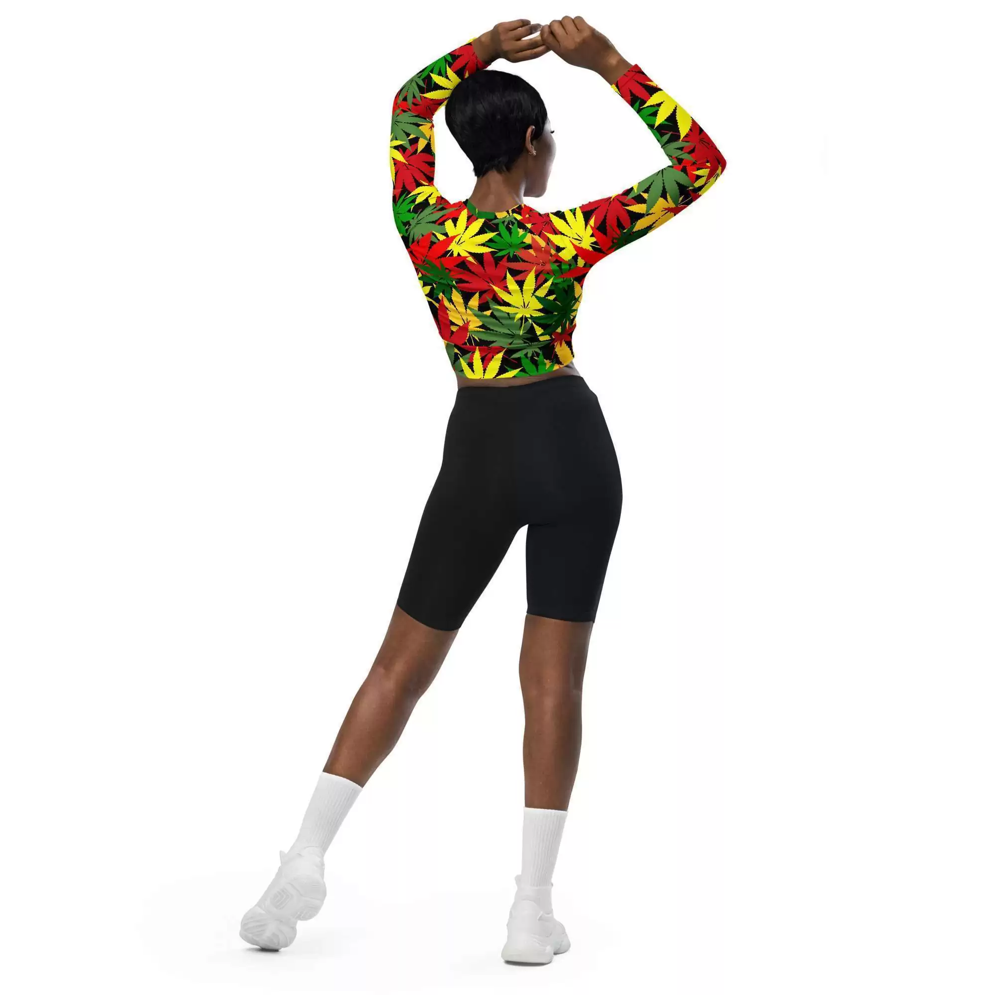 Rasta hemp crop top model back full length view has long sleeves and is a vibrant hemp leaf design in the Rastafarian colors with a black background and stitching.