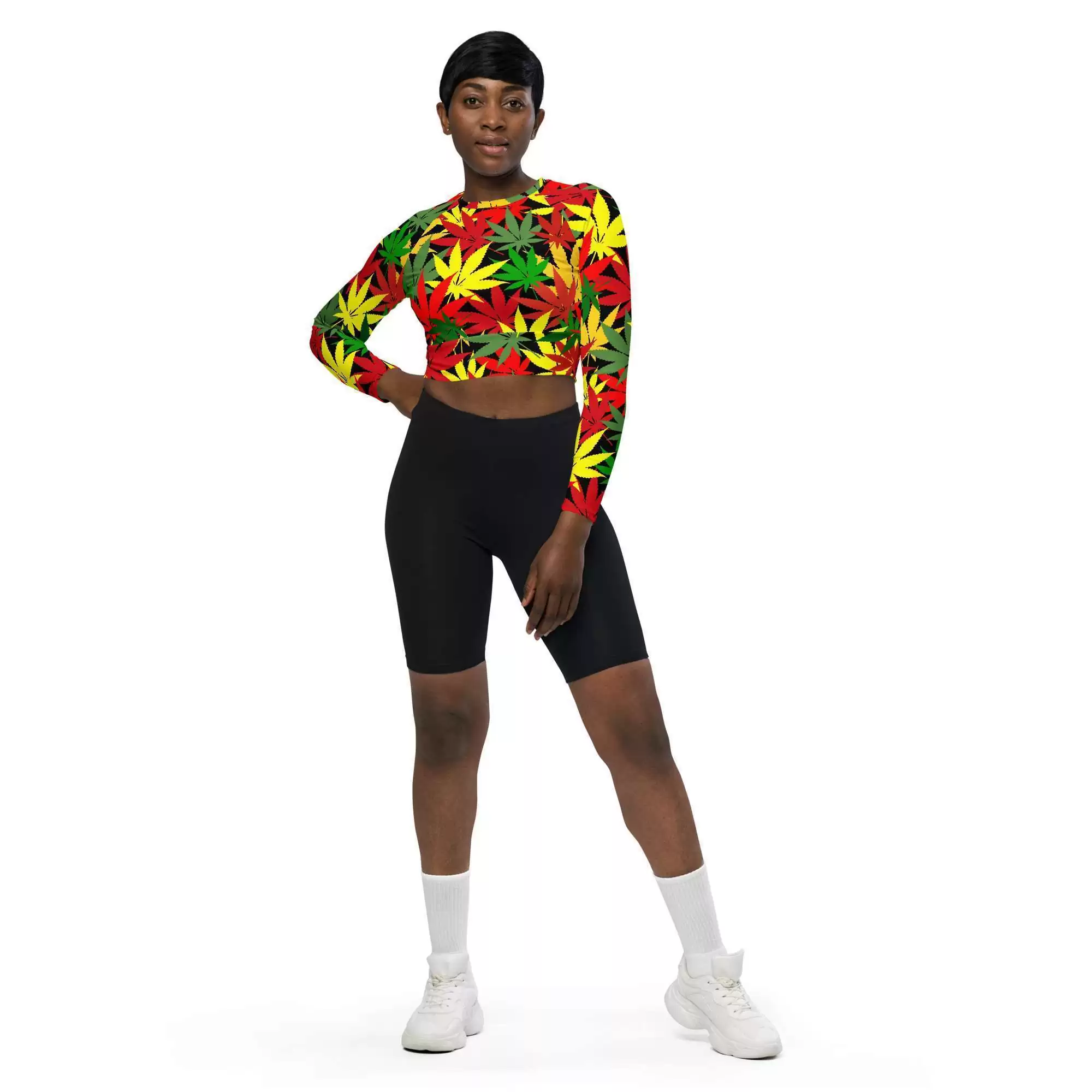 Rasta hemp crop top model front full length view has long sleeves and is a vibrant hemp leaf design in the Rastafarian colors with a black background and stitching.