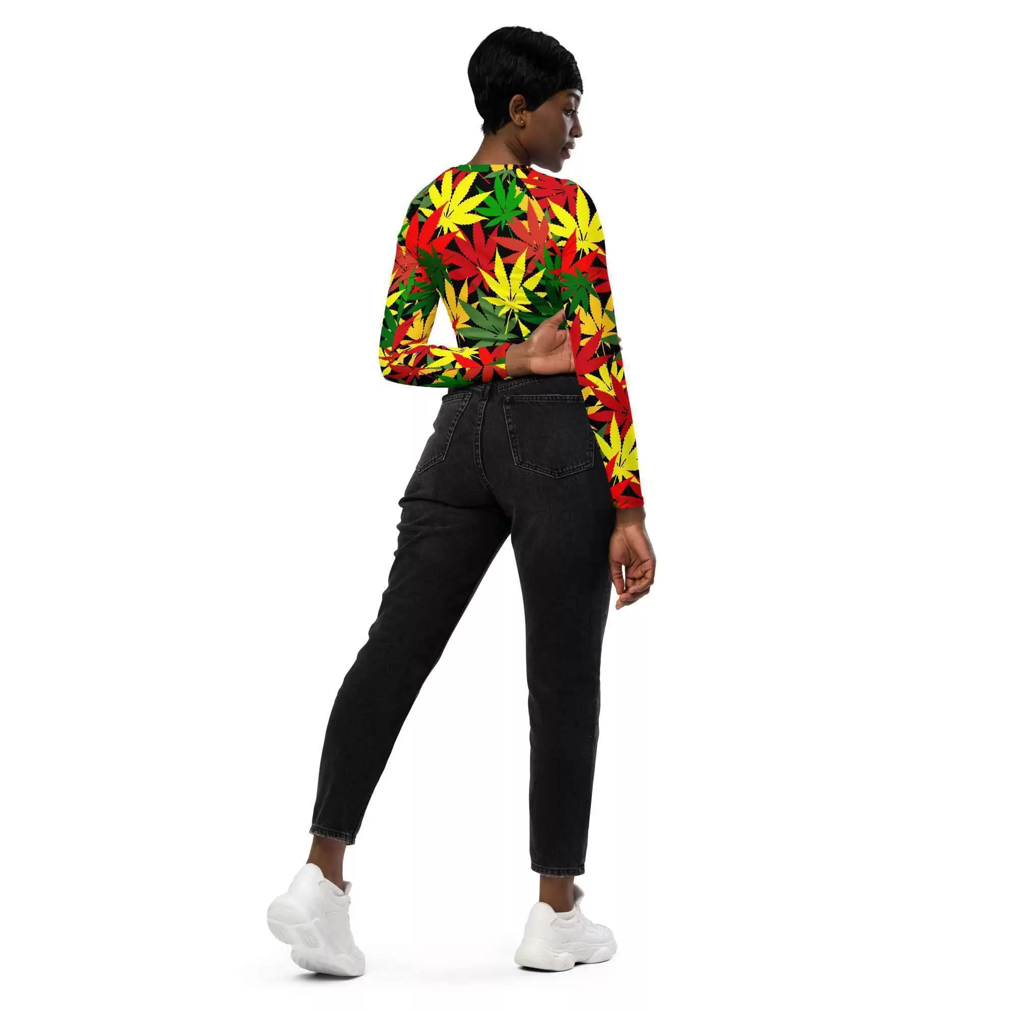 Rasta hemp crop top model model back view has long sleeves and is a vibrant hemp leaf design in the Rastafarian colors with a black background and stitching.