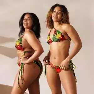 Rasta Hemp string bikini made from a hemp leaf design in the Rastafarian colors two models front view. Vivid colors on black background. Soft, stretchy up to 6XL sizing.