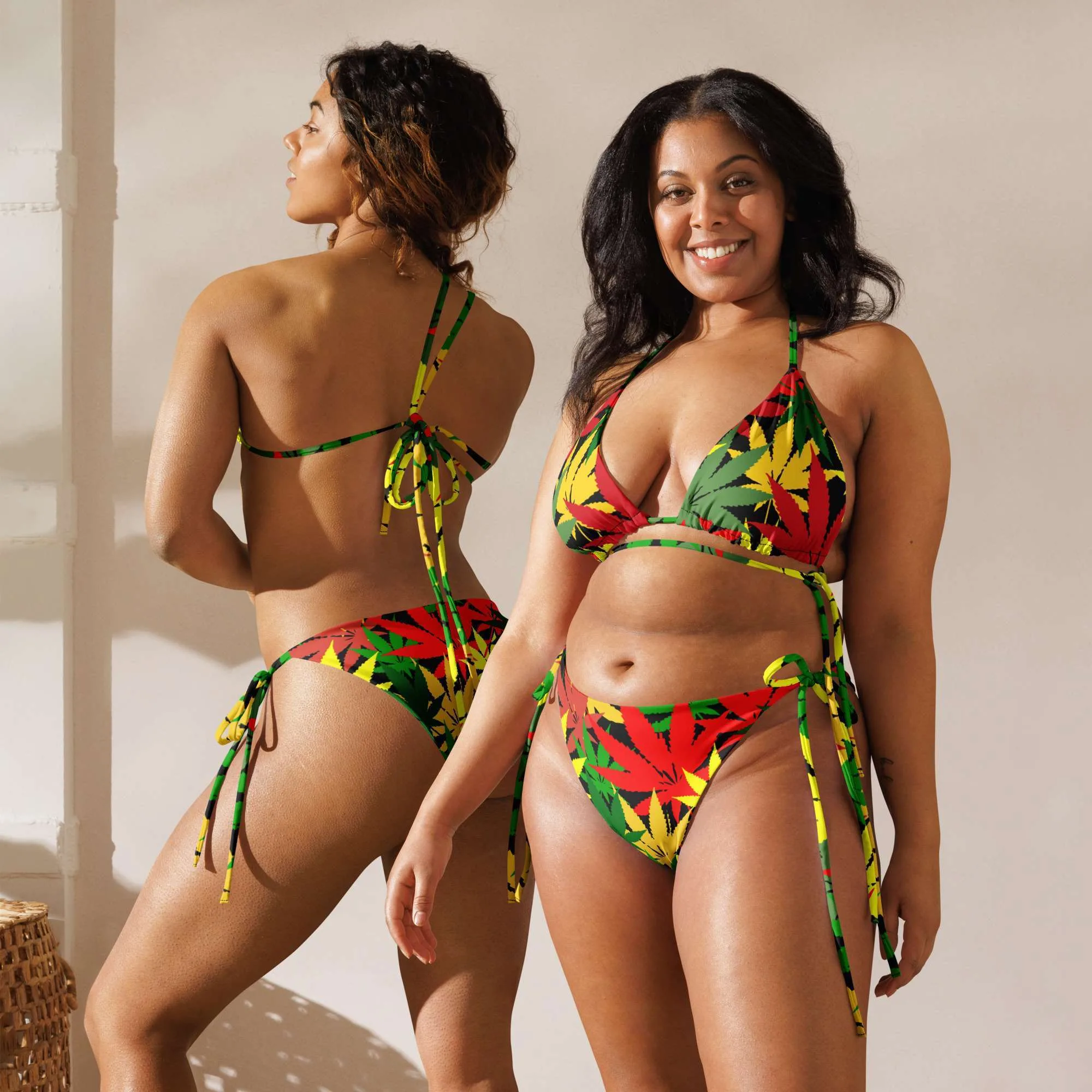 Rasta Hemp string bikini made from a hemp leaf design in the Rastafarian colors two different models front view. Vivid colors on black background. Soft, stretchy up to 6XL sizing.
