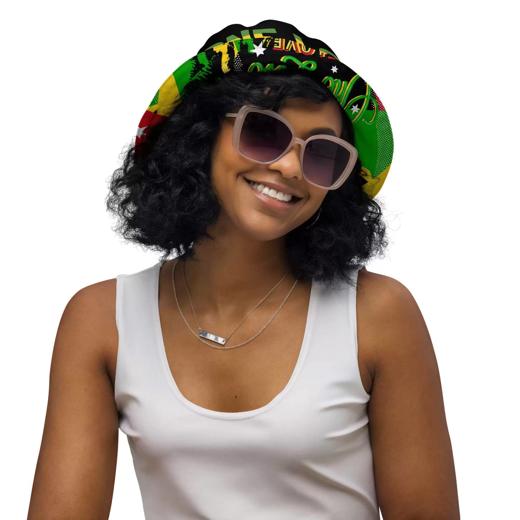 Rasta Reggae Reversible bucket hat model front inside view with funky red gold and green design on the outside and black one love Lion of Judah design on the inside.