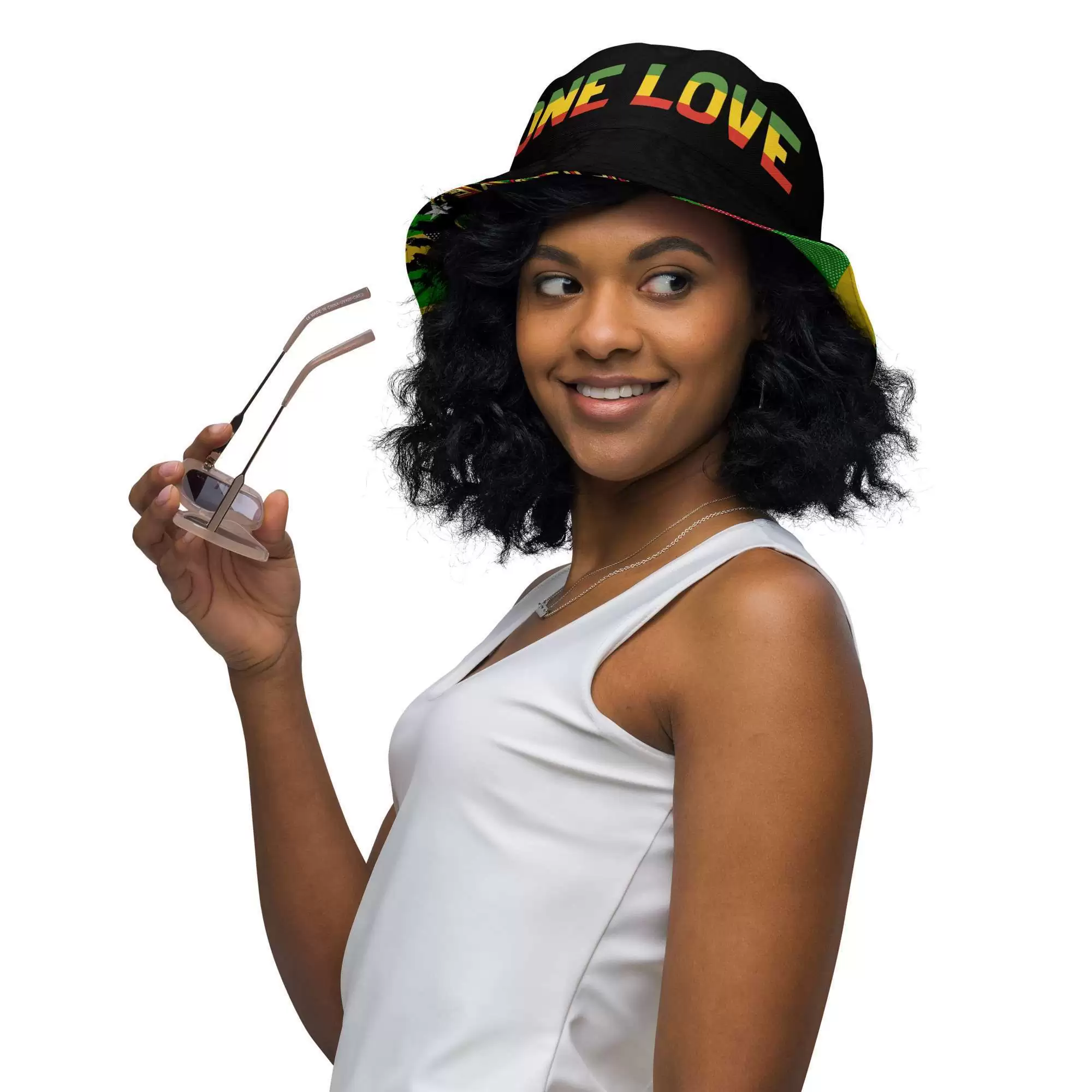Rasta Reggae Reversible bucket hat model front inside front view with funky red gold and green design on the outside and black one love Lion of Judah design on the inside.