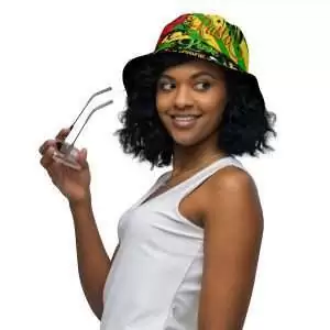 Rasta Reggae Reversible bucket hat model front outside view with funky red gold and green design on the outside and black one love Lion of Judah design on the inside.