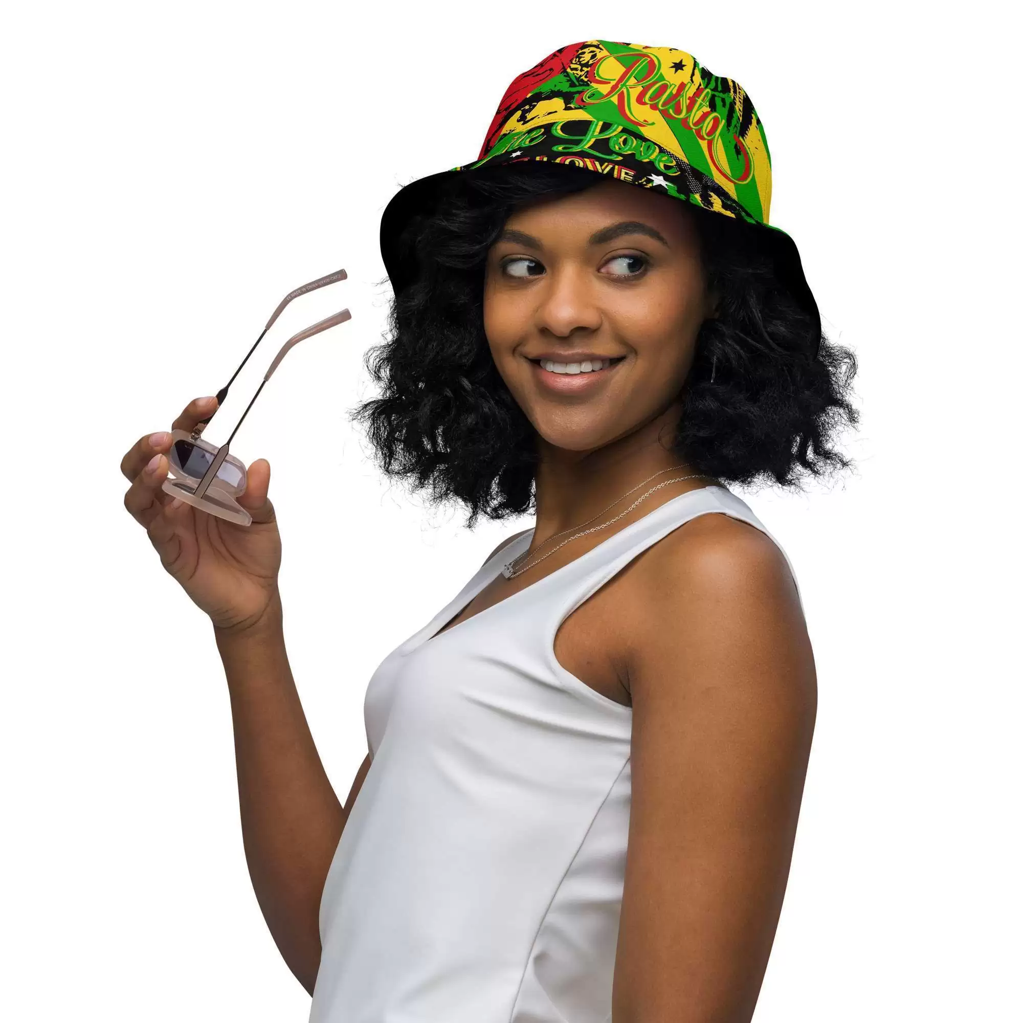Rasta Reggae Reversible bucket hat model front outside view with funky red gold and green design on the outside and black one love Lion of Judah design on the inside.