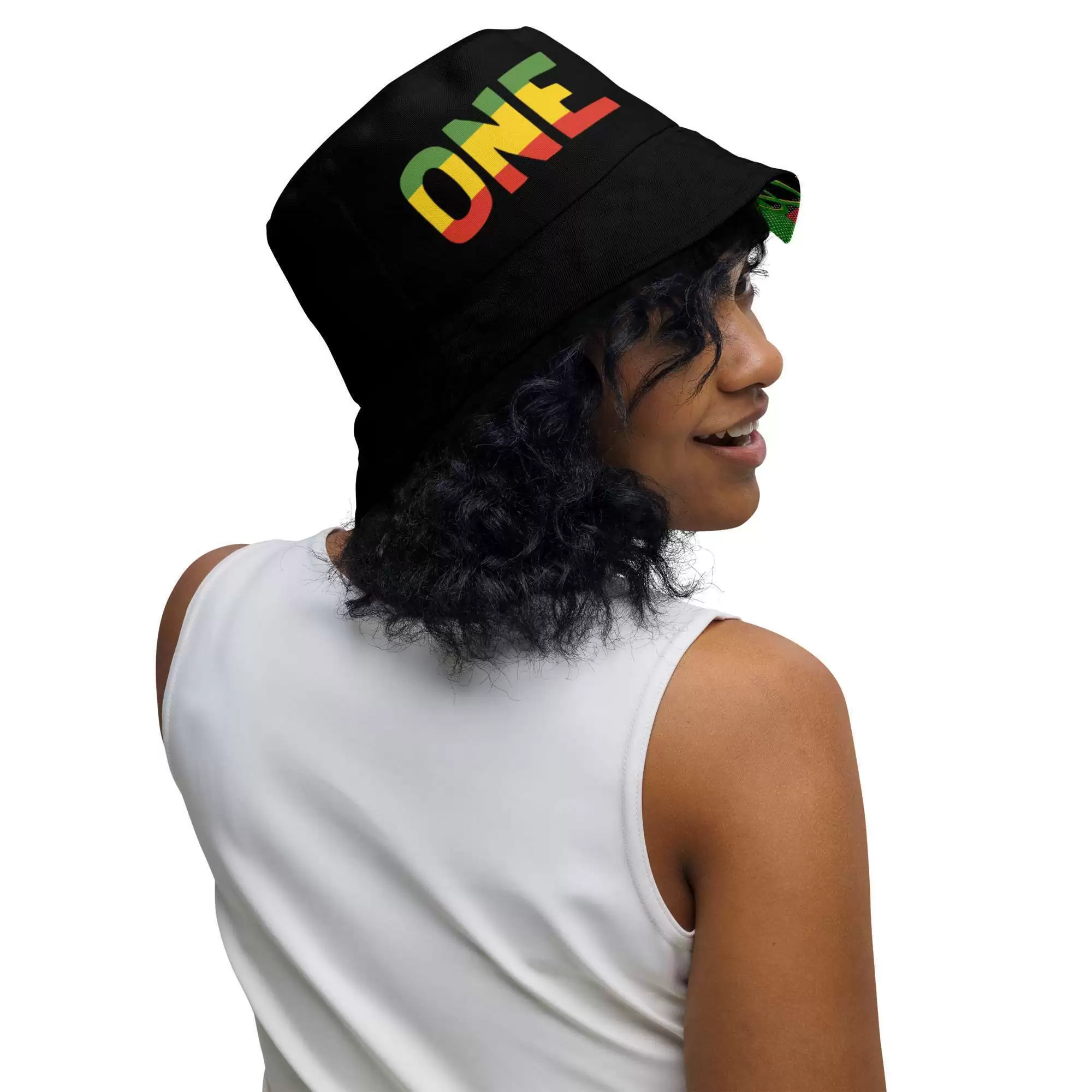Rasta Reggae Reversible bucket hat model front inside front view with funky red gold and green design on the inside side and black one love Lion of Judah design on the inside.
