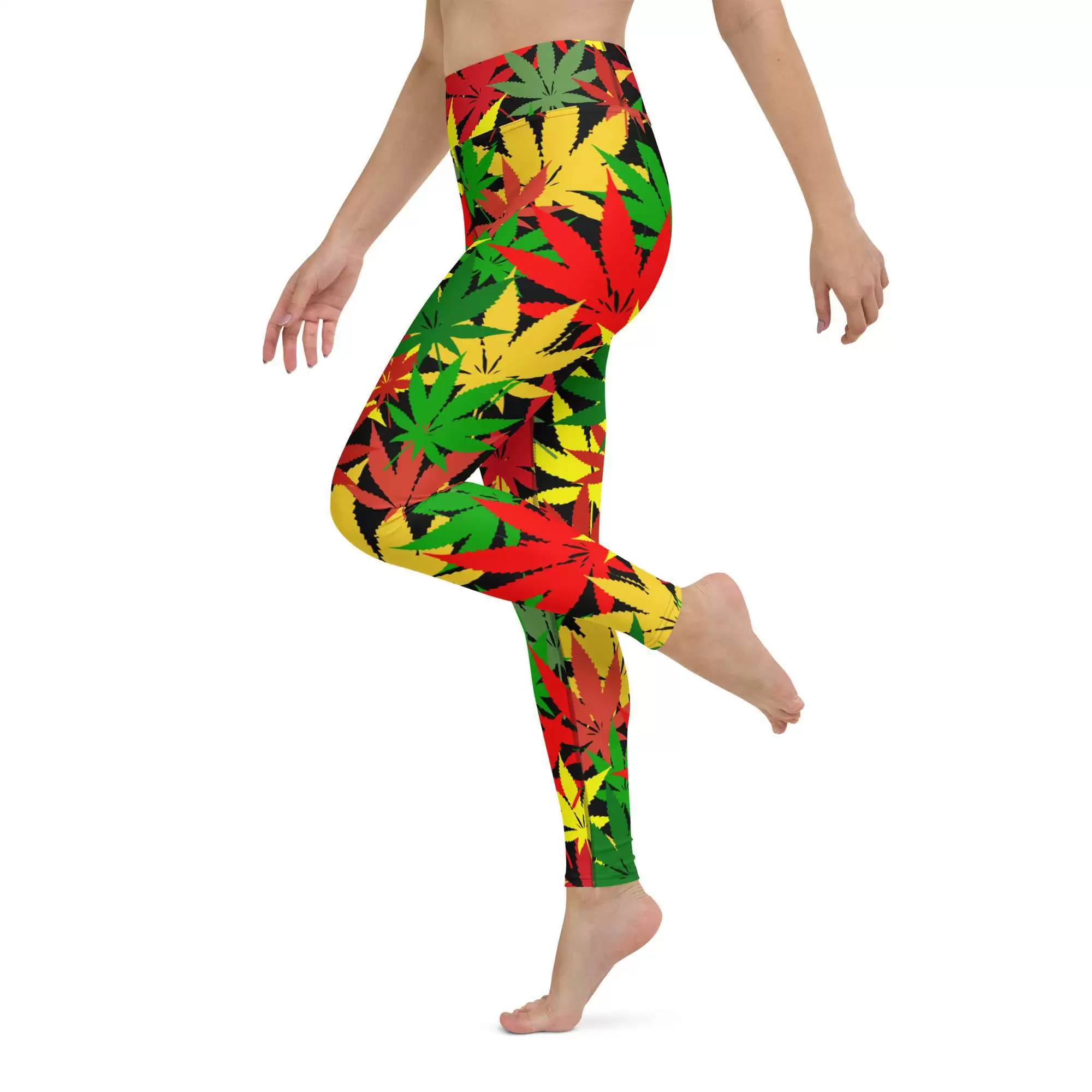 Rasta Hemp Yoga Leggings model side leg up left view are soft, stretchy and really comfortable. Hemp leaf graphic in the Rastafarian colors on black background.