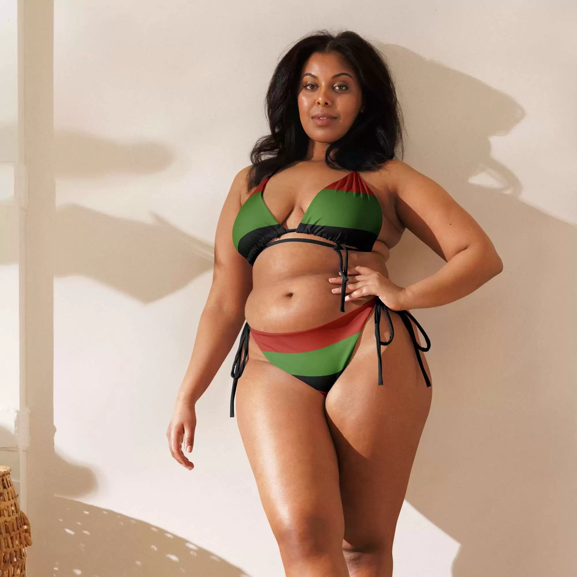 Afro American string bikini model front view soft and comfortable in sizes up to 6XL. Pan African Marcus Garvey colors with black lining. Original design Rastaseed.com