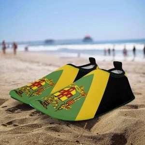 Jamaican Out of Many Water shoes top view in the Jamaican colors with coat of arms. Out of Many One People at Rastaseed shoes clothing and merchandise