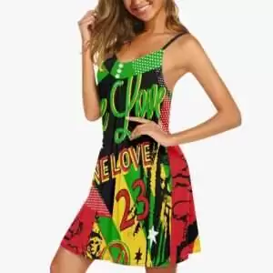 Rasta Reggae Party Sundress with spaghetti straps front left side model view. Fun party design on this Jamaican dress for the Summer heat or the beach.
