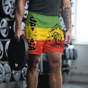 Rastafarian Shorts in red gold and green front model view with Jamaica and Lion of Judah design. Great for the beach or on vacation in the hot weather.
