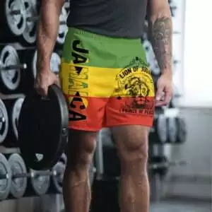 Rastafarian Shorts in red gold and green front model view with Jamaica and Lion of Judah design. Great for the beach or on vacation in the hot weather.