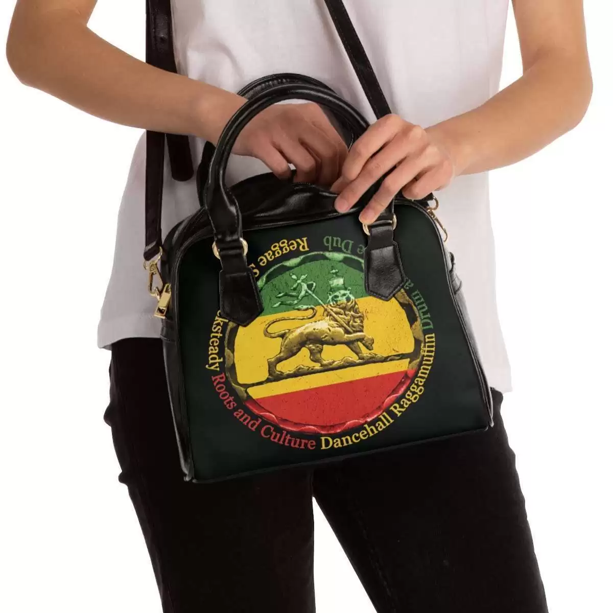 Reggae purse model view with shoulder strap made from PU leather. Black with the Reggae colors and Lion of Judah Design stamp featuring Reggae genres.