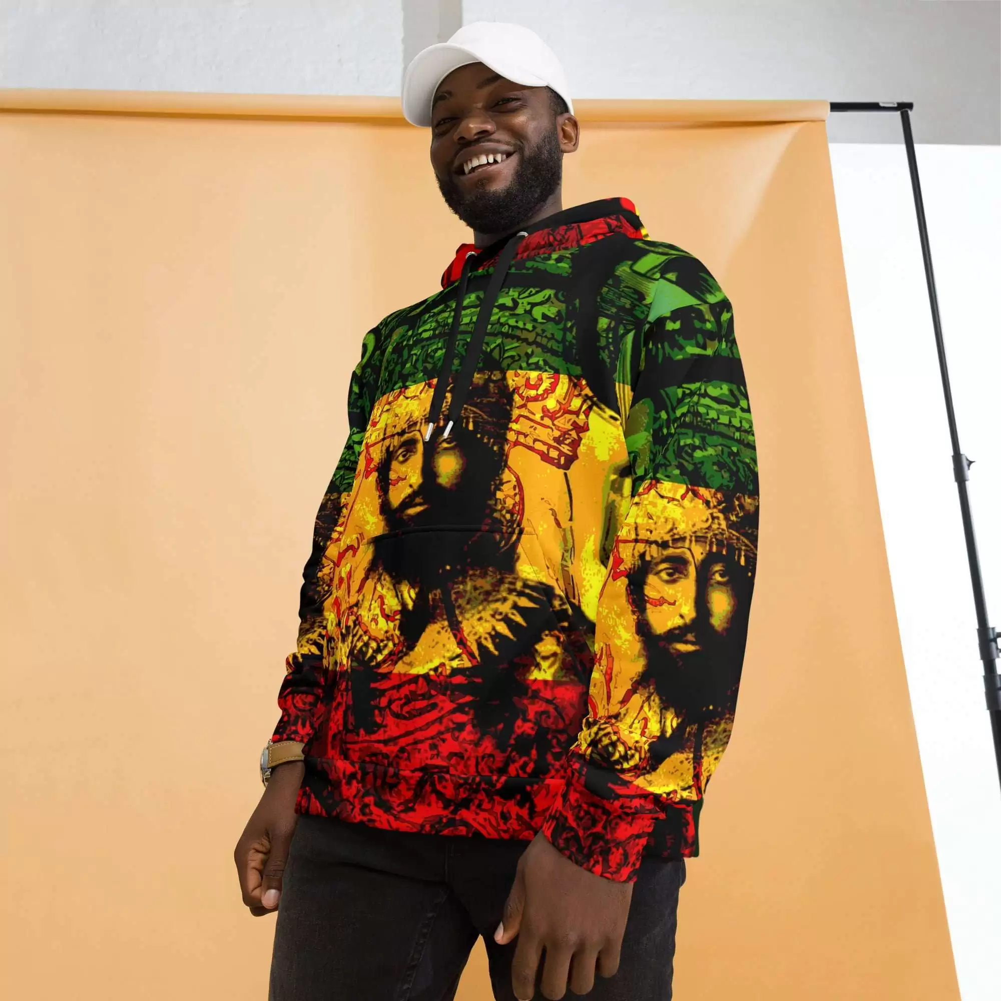 Haile Selassie Natural Mystic Hoodie model side front view in sizes 2XS to 6XL. Soft fabric in vivid red gold and green design. Original design from Rastaseed.com