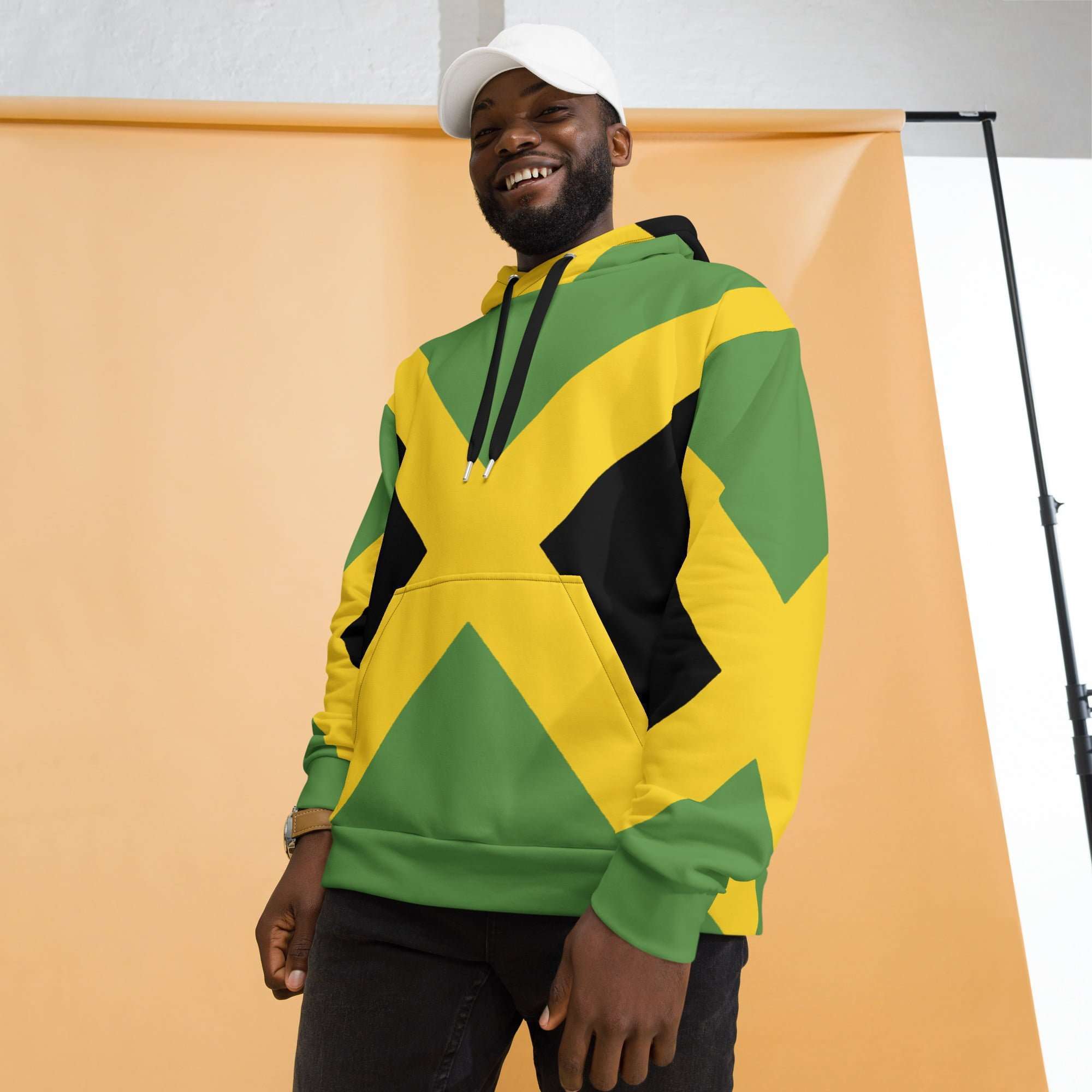 Jamaican Flags Hoodie model view in warm cosy fabric with fleece lining, double hoodie and front pocket. Rastaseed Jamaican merchandise and clothing.