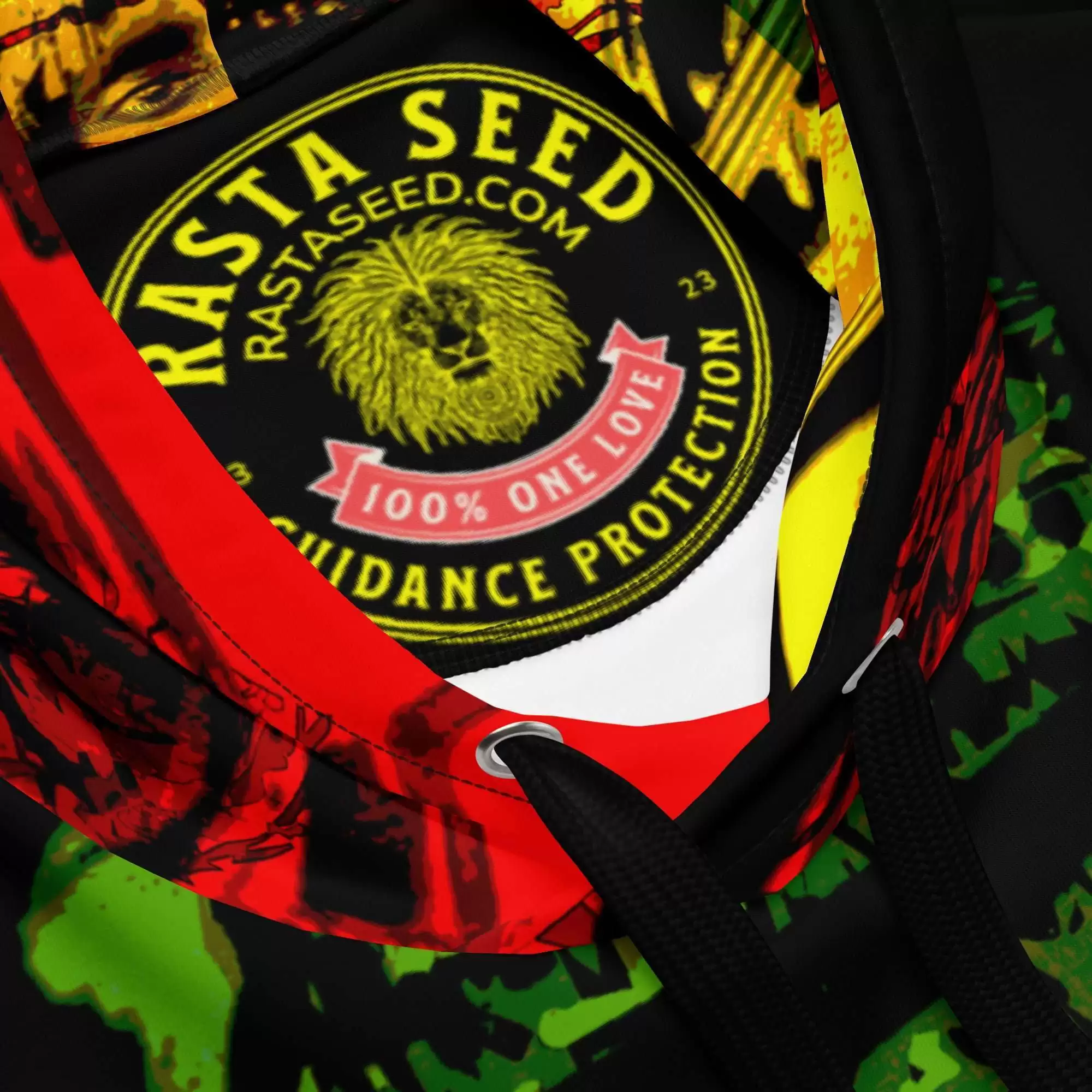Haile Selassie Natural Mystic Hoodie label branding view in sizes 2XS to 6XL. Soft fabric in vivid red gold and green design. Original design from Rastaseed.com