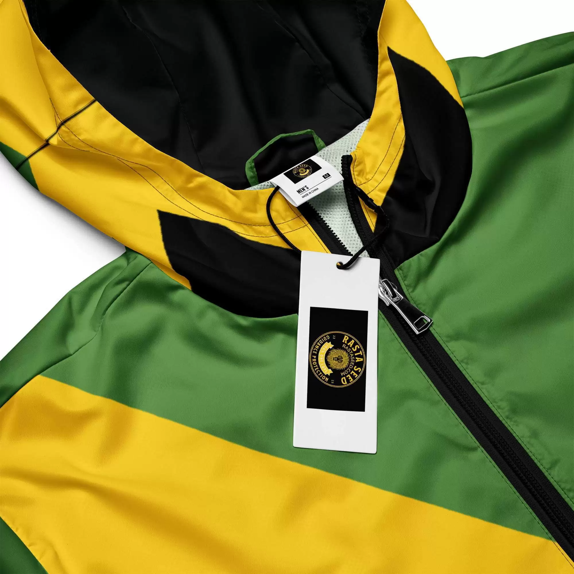 Jamaican Men’s windbreaker branding label view in JA colors with front zip and hood. Great for unexpected rain showers in the city or country.