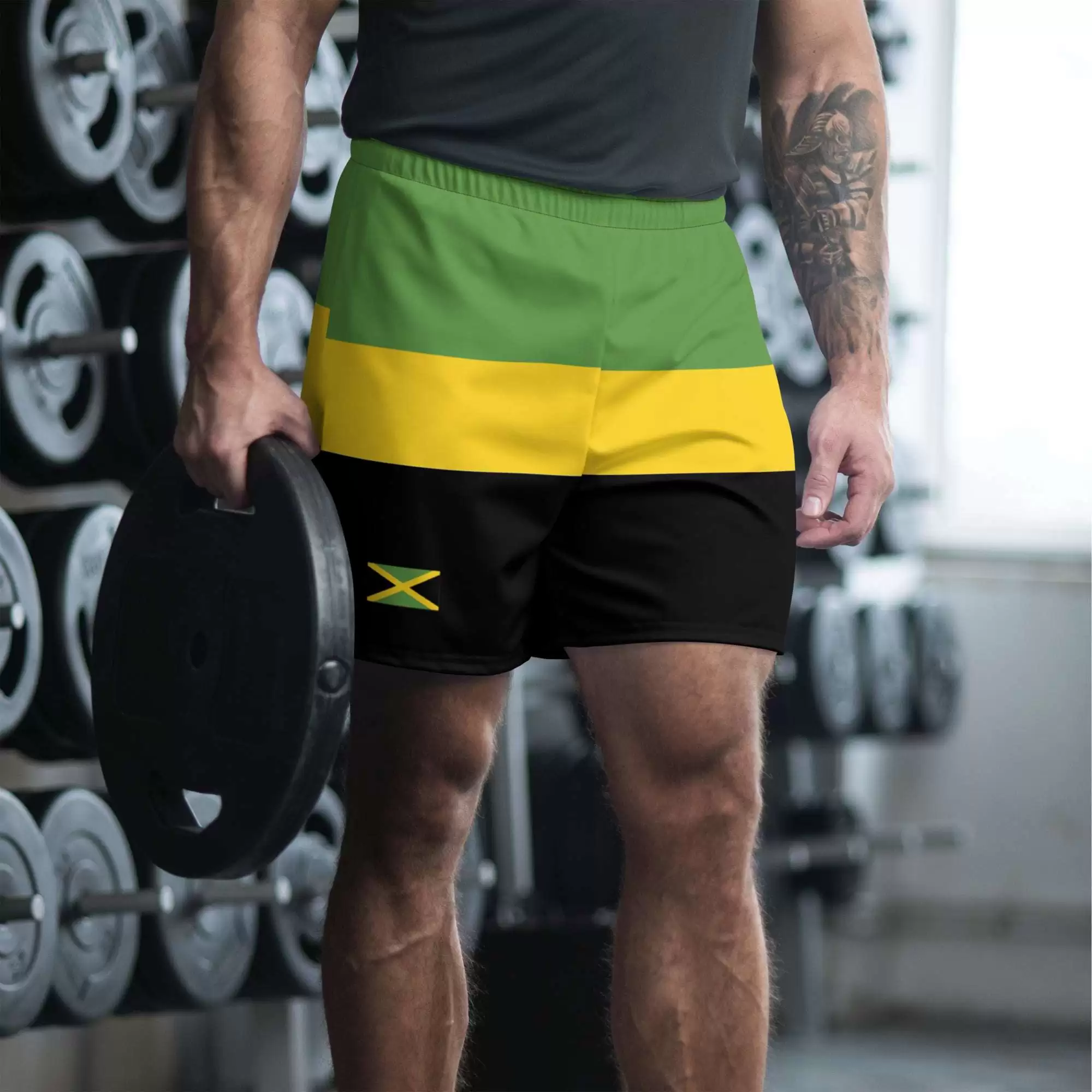Jamaica swim trunks model front view in the jamaican colors. Great for an island vacation surfing, swimming, running, hiking or walking, Jamaica flag on front leg.