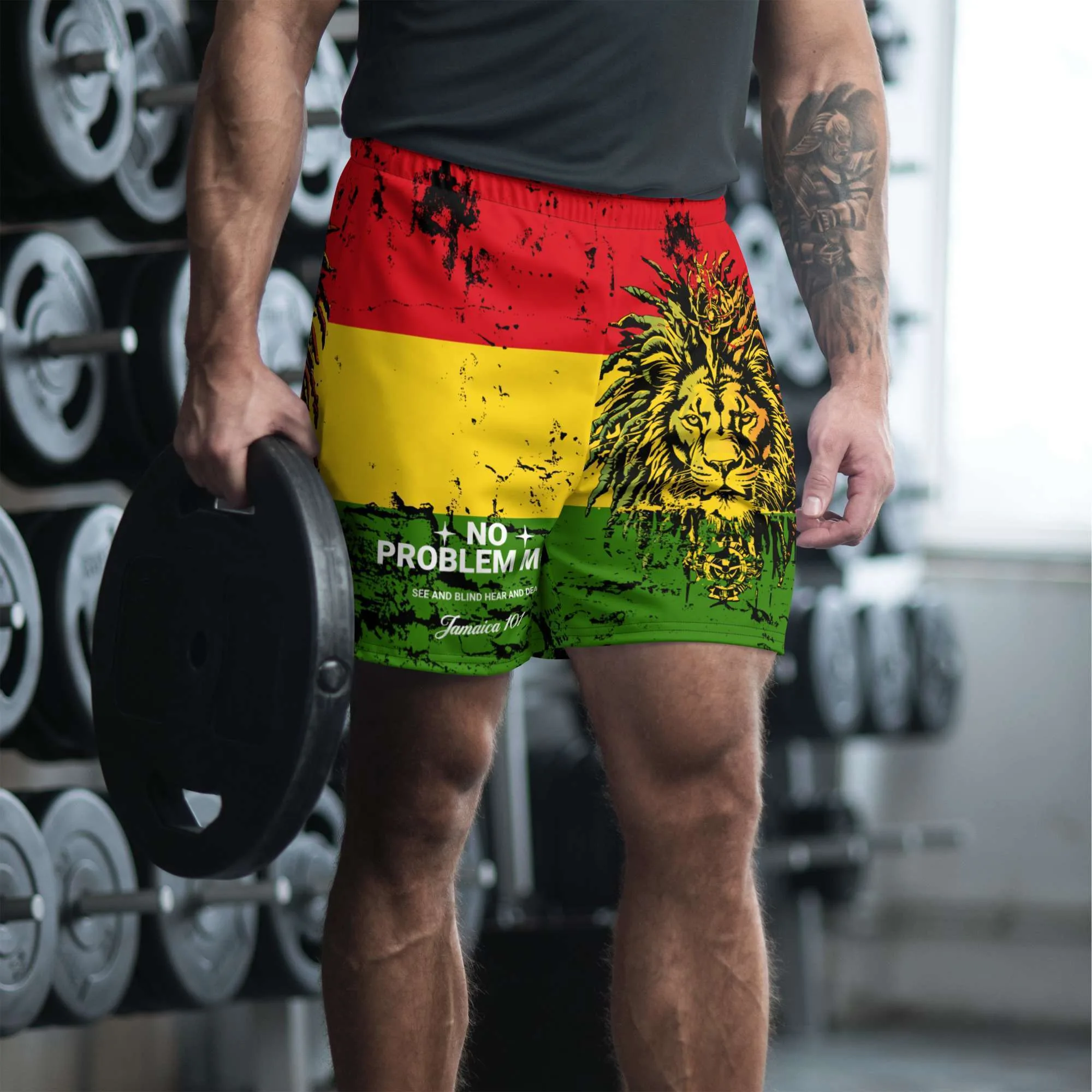 Jamaican shorts in the red gold and green with Lion and No Problem Mon front model view. Small to large sizes in a unisex design. Rastaseed original merchandise.