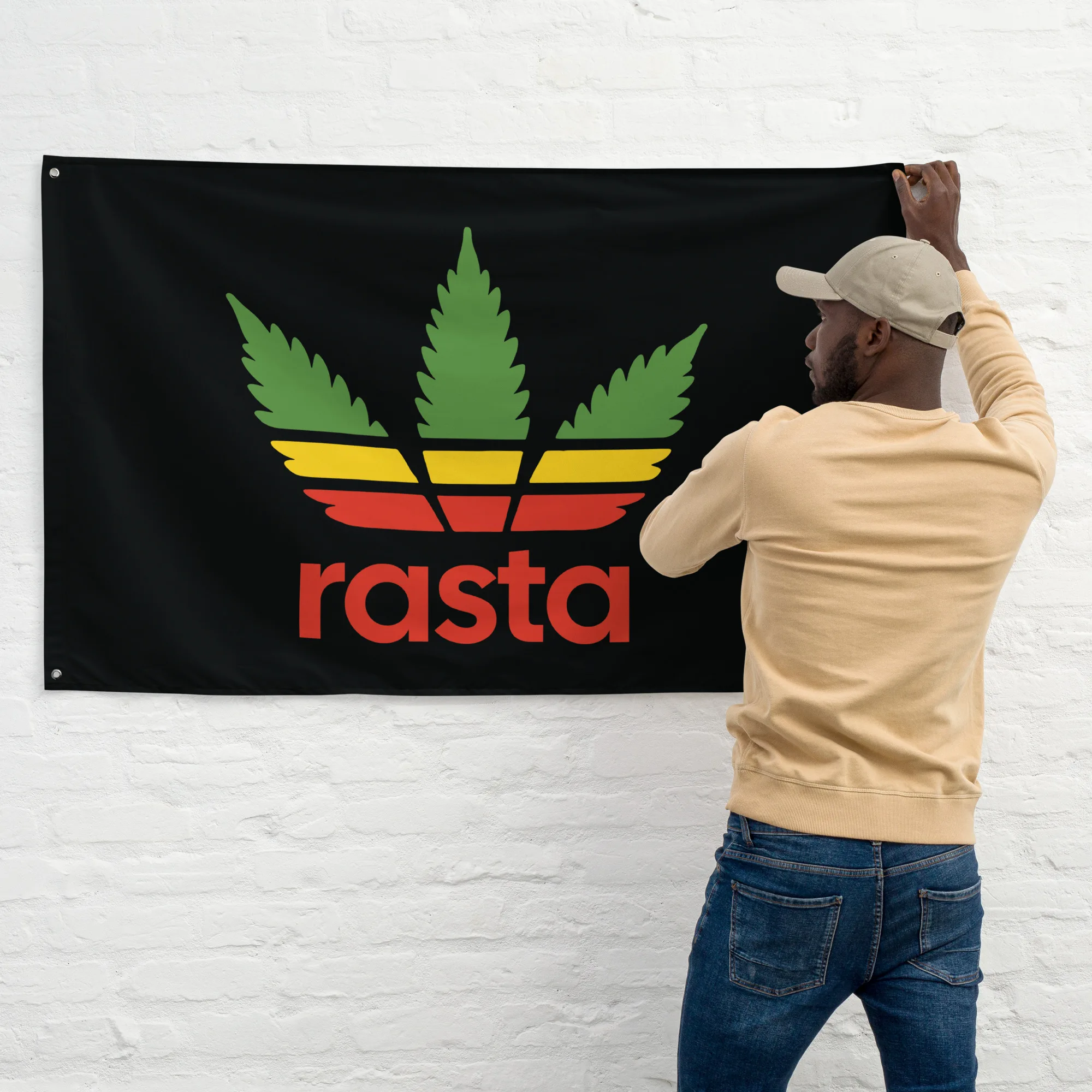 Rasta leaf flag with black background and stylised hemp leaf design in Rastafarian colors wall view. Rastaseed merchandise and gear.