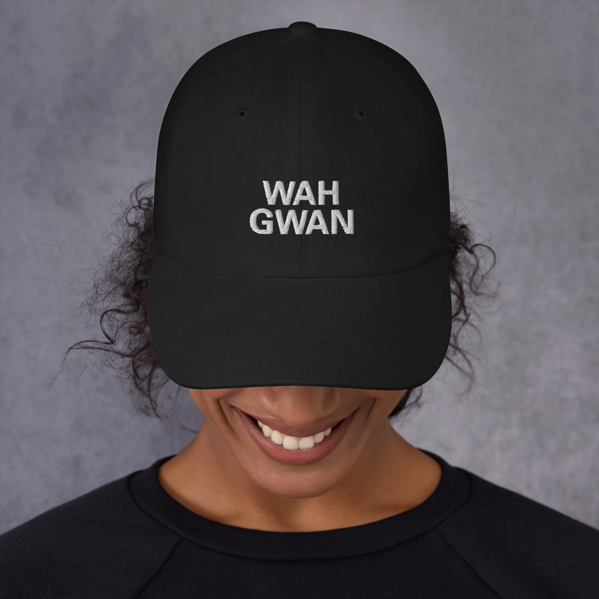 Wah Gwan Patois Cap front view camo in Dad hat style available in black and khaki camouflage print. Original Jamaican merchandise at Rastaseed clothing store. Front black model view.