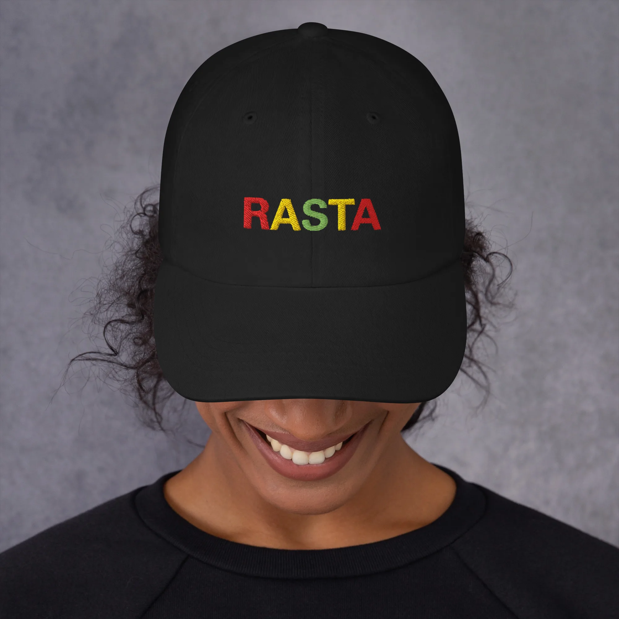 Rasta Cap in dad hat style front view and available in khaki camouflage or black with red gold and green embroidered letters. Original Rasta gear at Rastaseed shop. Front black model view