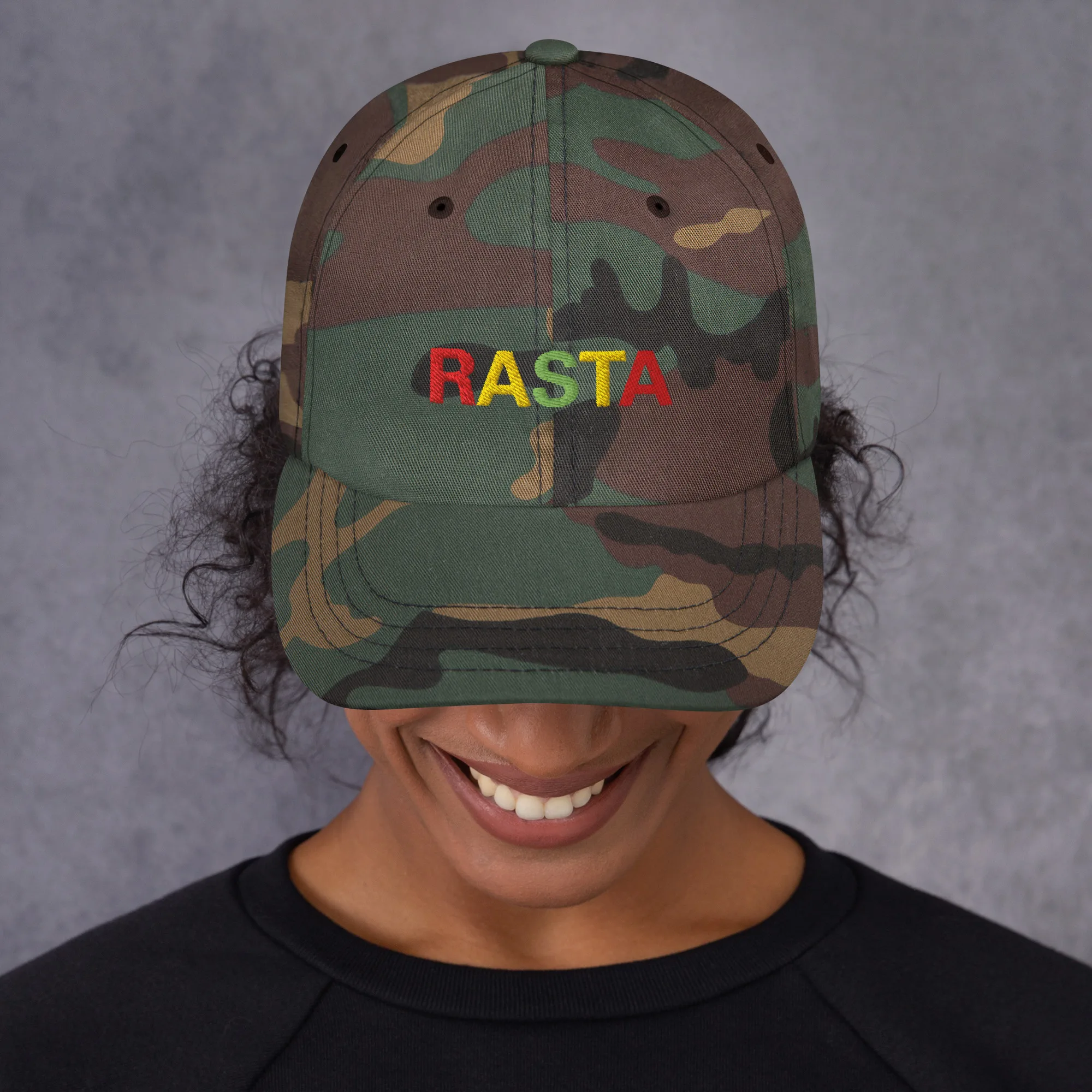 Rasta Cap in dad hat style front view and available in khaki camouflage or black with red gold and green embroidered letters. Original Rasta gear at Rastaseed shop. Front camo model view