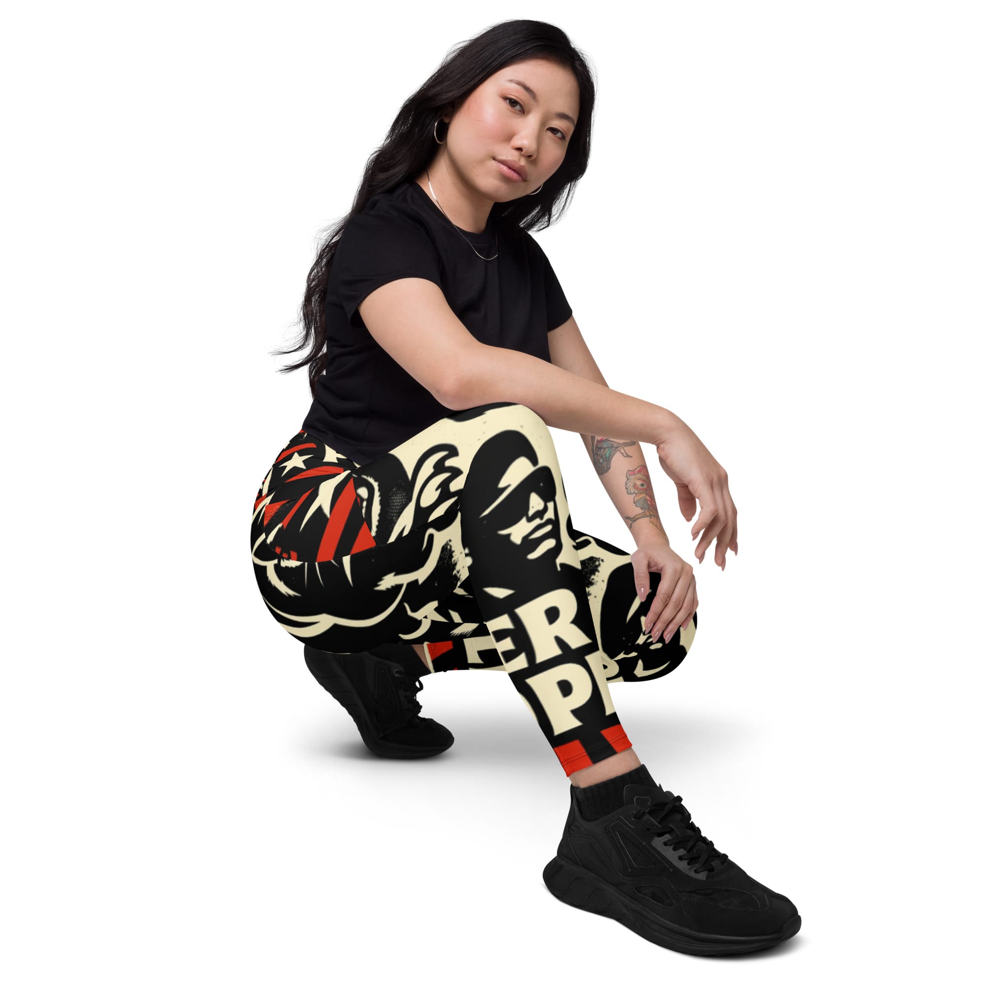 Rasta Power to the People Leggings with pockets kneeling model view. Black Panther leggings in black white and red. Rastaseed Jamaican Reggae Afro American merchandise.